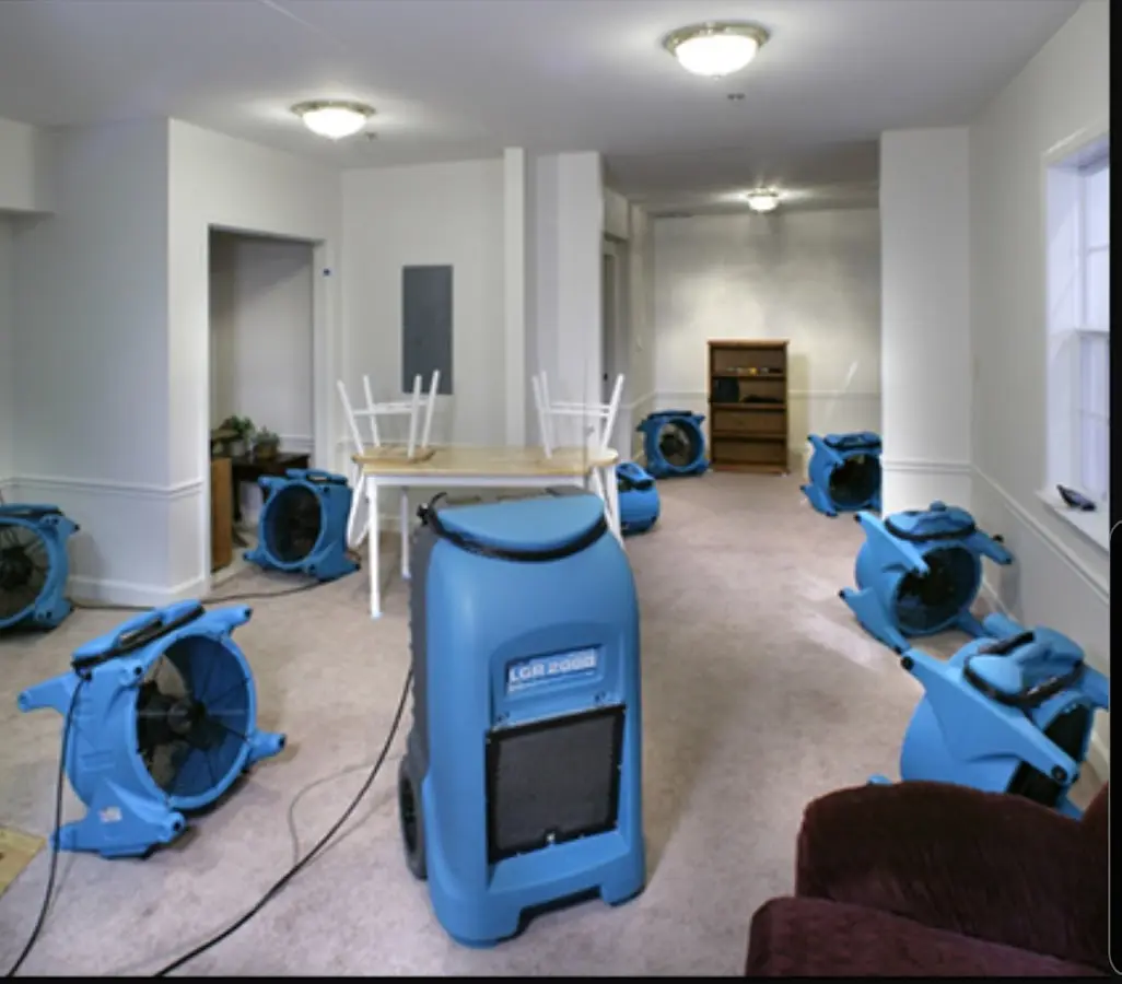 Air movers and dehumidifier setup for Water Damage Restoration in Celina
