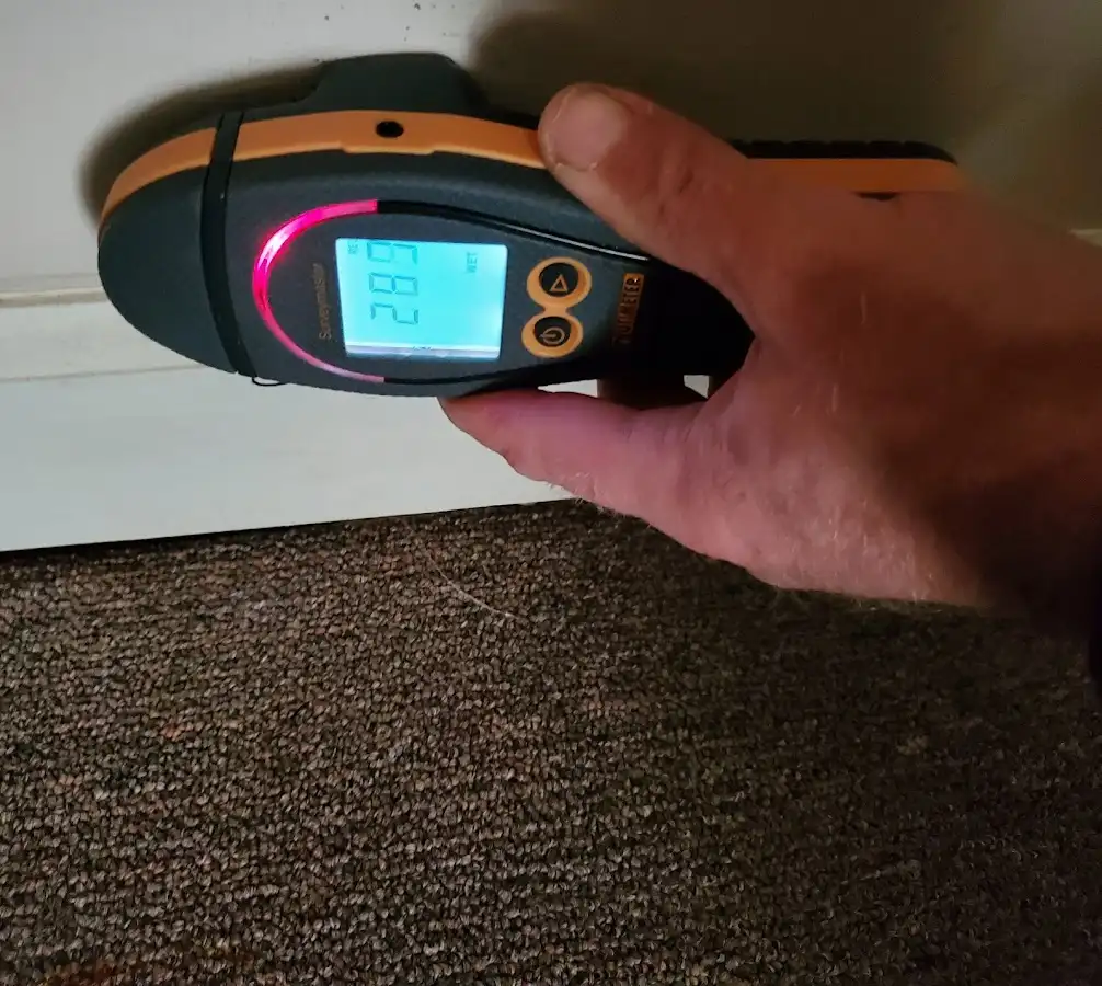 Moisture detection at baseboard during Burst Pipe Cleanup in Celina